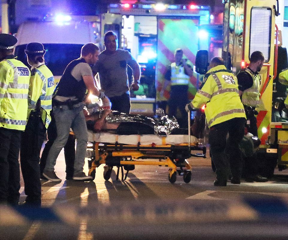4112F9AF00000578-4569638-A_wounded_victim_was_wheeled_out_on_stretcher_by_London_Bridge_a-a-3_1496559925530.jpg