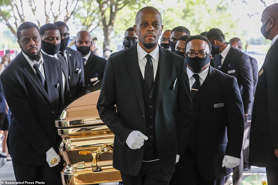 29408246-8401421-Pallbearers_bring_the_coffin_into_The_Fountain_of_Praise_church_-a-43_1591715727926.jpg